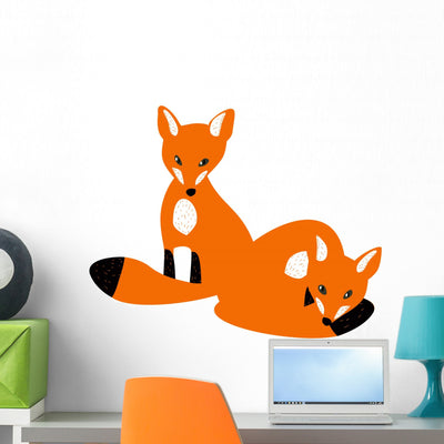 Two Red Baby Foxes Wall Decal shown on a wall