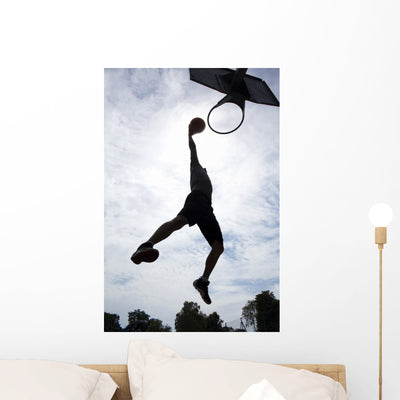 Basketball Player Slam Dunk Wall Decal shown on a wall