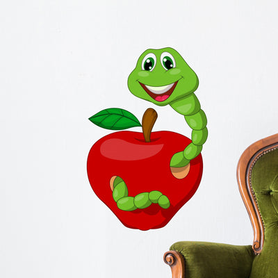 Worm with Red Apple Wall Decal shown on a wall
