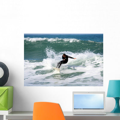 Surfing Wall Decal shown on a wall