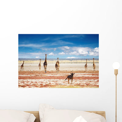 Blue Wildebeest and Giraffes Wall Decal shown on a wall