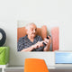 Old lady using a smartphone Wall Mural