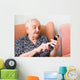 Old lady using a smartphone Wall Mural