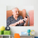 Old lady using a smartphone Wall Mural