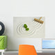 Green leaf on raked white sand of a zen garden Wall Mural