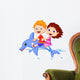 Boy and girl riding a dolphin Wall Decal