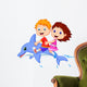 Boy and girl riding a dolphin Wall Decal