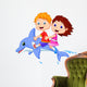 Boy and girl riding a dolphin Wall Decal