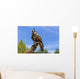 Falcon perched on its trainers hand Wall Mural