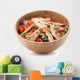 Grilled chicken salad in wooden bowl isolated on white Wall Decal
