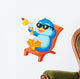 Cute penguin sitting on beach chair Wall Decal