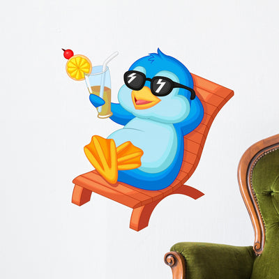 Cute Penguin Sitting Beach Wall Decal shown on a wall