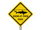 Use Caution When Swimming Because Sharks Are Present 