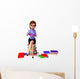 Young girl sitting on the pile of books Wall Decal
