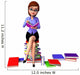 Young girl sitting on the pile of books Wall Decal