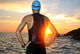Young Athlete Triathlon in Front of Sunrise 