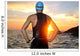 Young Athlete Triathlon in Front of Sunrise 