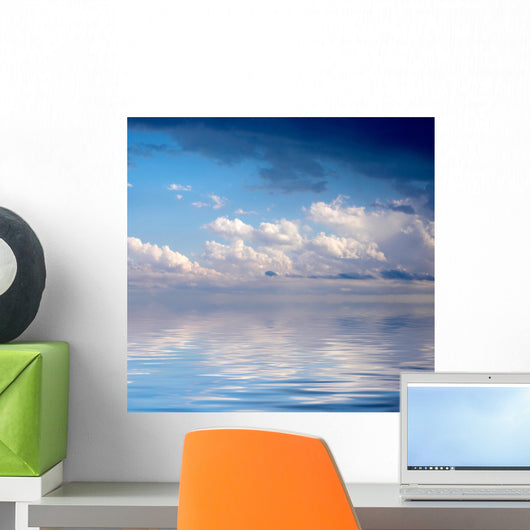 Blue dramatic sky over water Wall Mural