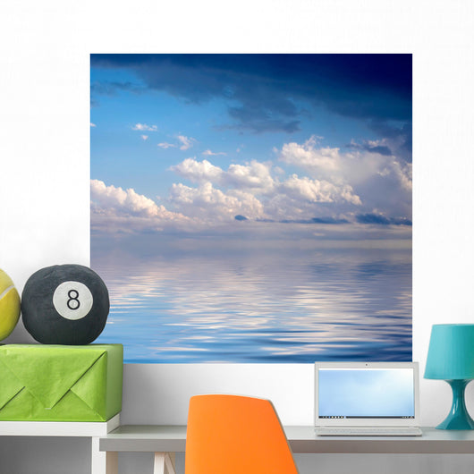 Blue dramatic sky over water Wall Mural
