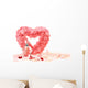 Heart of roses with perfume bottle on white background Wall Mural