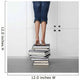 teenage girl standing on top of a stack of books Wall Mural