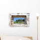 spanish countryside seen through hole in wall of ruins Wall Mural