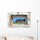 spanish countryside seen through hole in wall of ruins Wall Mural
