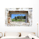 spanish countryside seen through hole in wall of ruins Wall Mural