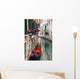 Backstreet canal Venice with empty gondola 