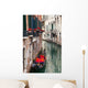 Backstreet canal Venice with empty gondola 