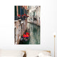 Backstreet canal Venice with empty gondola 
