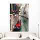 Backstreet canal Venice with empty gondola 