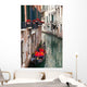 Backstreet canal Venice with empty gondola 