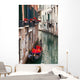 Backstreet canal Venice with empty gondola 
