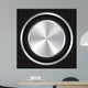 Metallic button on Carbon fiber background. Wall Mural