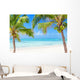 Tropical beach with coconut palms and transparent waters 