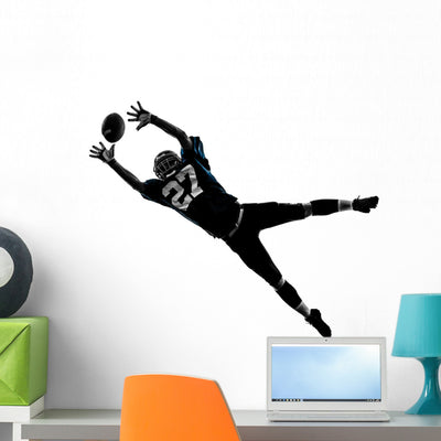 Receiving American Football Player Wall Decal shown on a wall