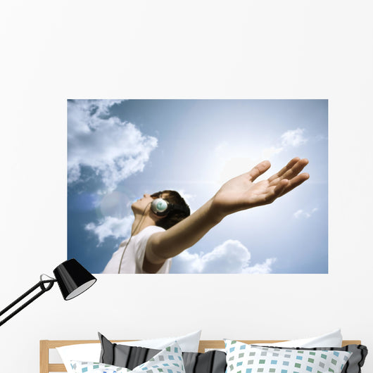 teen with headphones enjoy the music,focus point on hand Wall Mural