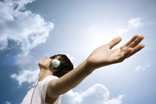 teen with headphones enjoy the music,focus point on hand Wall Mural