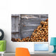 Firewood to the wooden wall of a hut 