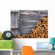 Firewood to the wooden wall of a hut 