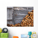 Firewood to the wooden wall of a hut 