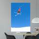 man skiing on slopes of ski resort in spain Wall Mural