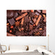 Background from slices of chocolate, coffee, nuts and spices Wall Mural