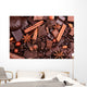 Background from slices of chocolate, coffee, nuts and spices Wall Mural