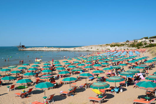 View of beach with umbrellas at beach near Vieste, Apulia,Italy 