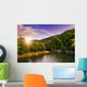 river flows by rocky shore near the autumn mountain forest Wall Mural