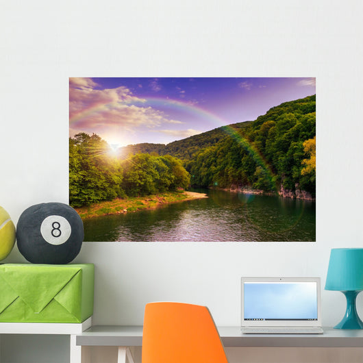 river flows by rocky shore near the autumn mountain forest Wall Mural