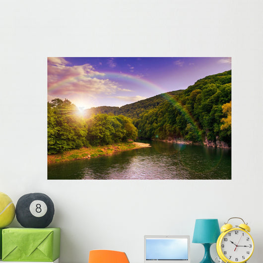 river flows by rocky shore near the autumn mountain forest Wall Mural