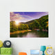 river flows by rocky shore near the autumn mountain forest Wall Mural